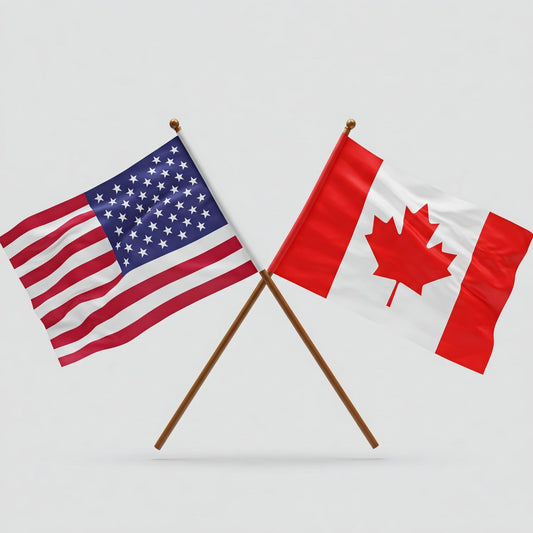 U.S. and Canada flags are next together.